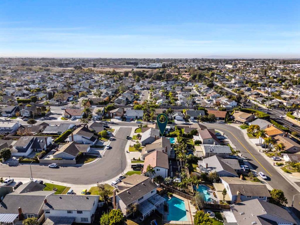 aerial view of neighborhood with an arrow pointing to 8561 pierre drive