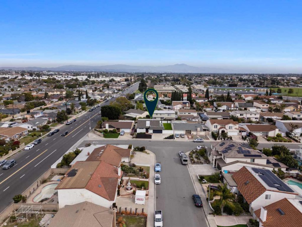 aerial view of home for sale in westminster neighborhood with arrow pointing to house