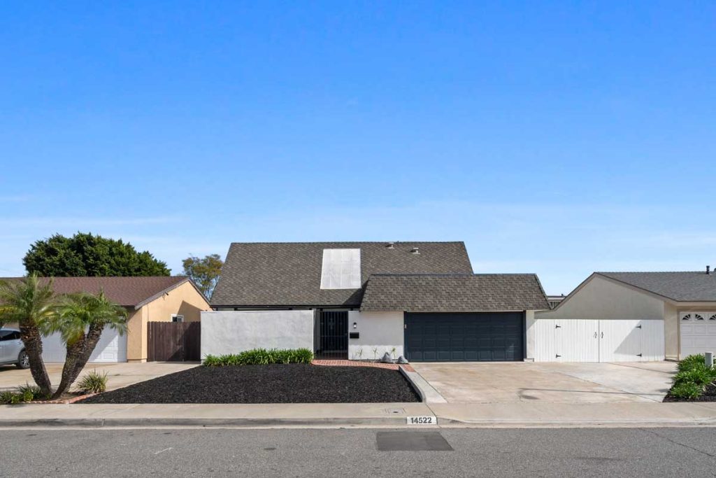 view of front of 14522 Petsworth Lane, Westminster. Home has white and blue color combo