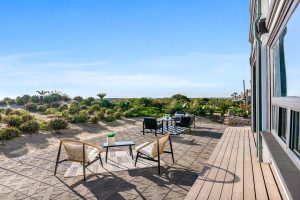 beachfront patio with dining set