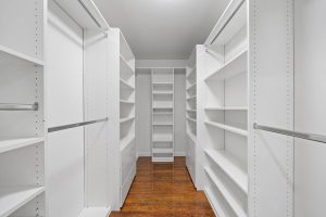 walk-in closet with white built-ins