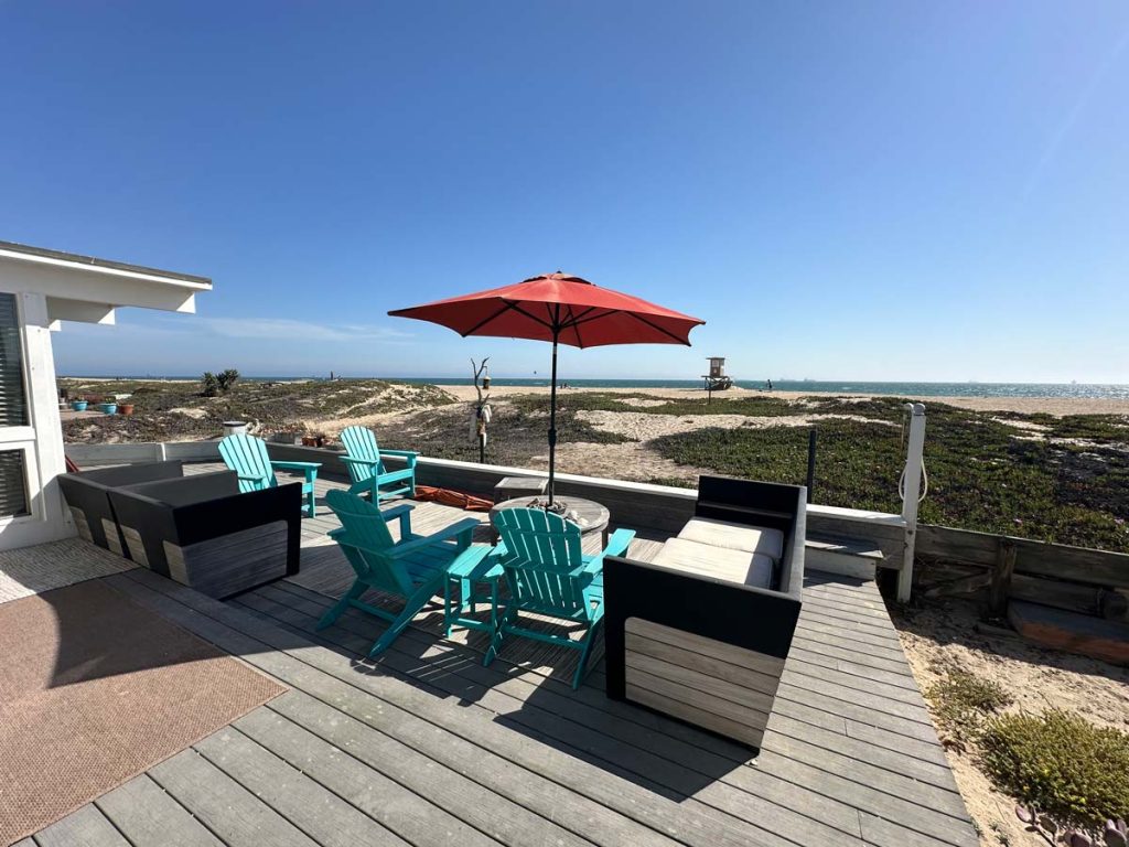 view off back desk of ocean with blue skies