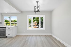 dining nook with neutral floors and walls.