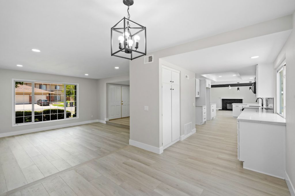 view of kitchen and open room by front door