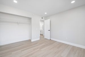 empty bedroom with neutral floors and walls.
