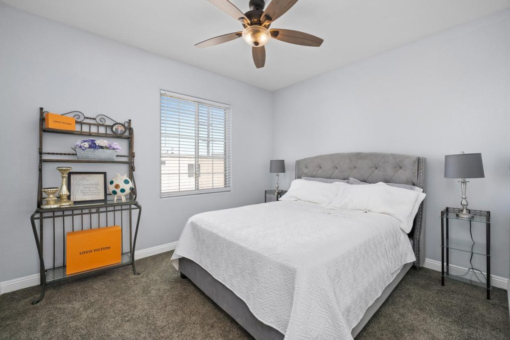 bedroom with carpet, bed and ceiling fan