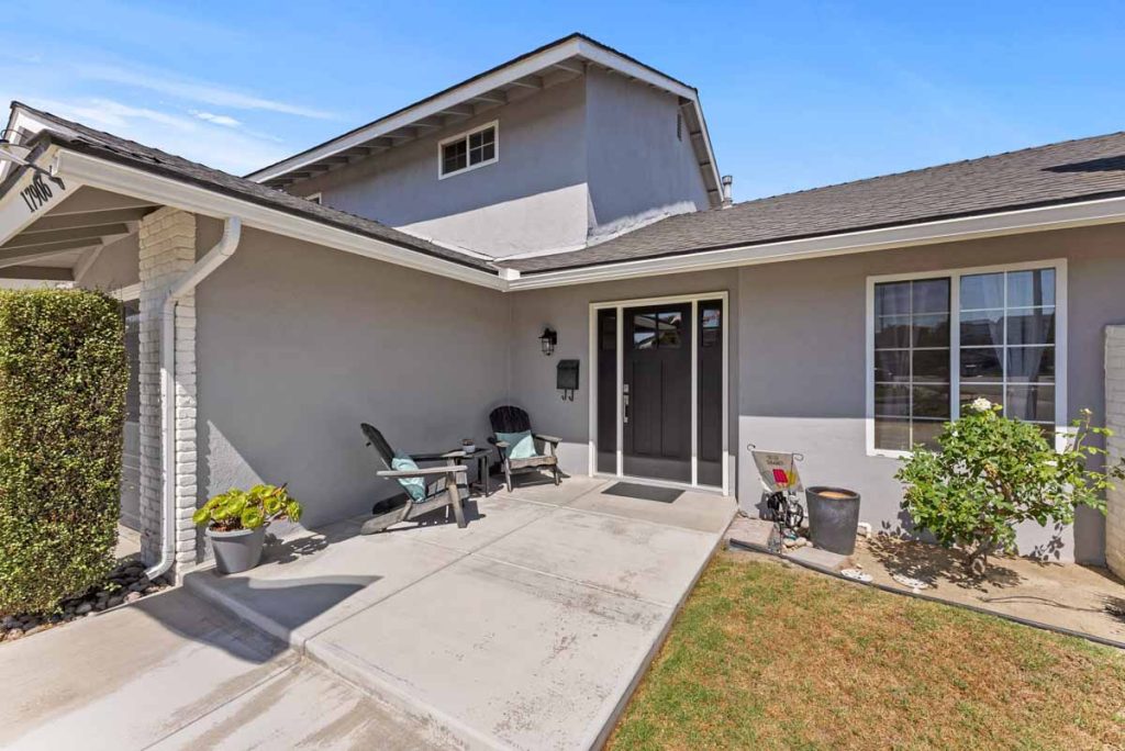 exterior entry way showing gray paint with white trim and black door