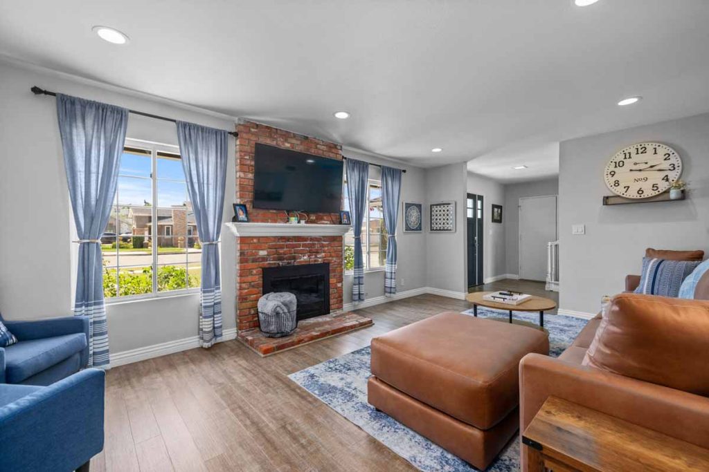 family room with brick fireplace and leather sofa