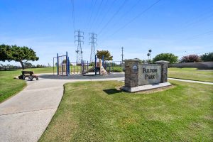 image of community showing sign reading Fulton Park with playground in background