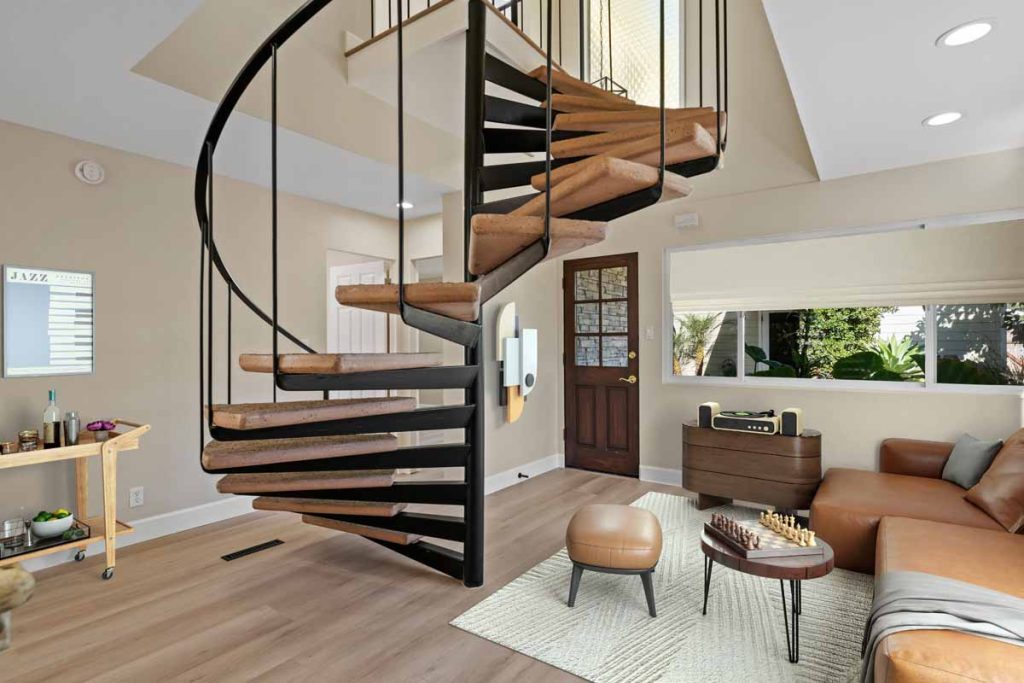 spiral staircase with floating stairs shown from the first floor.