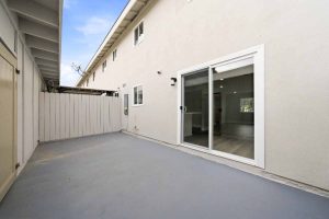 Patio with concrete and a sliding glass door to access the house.