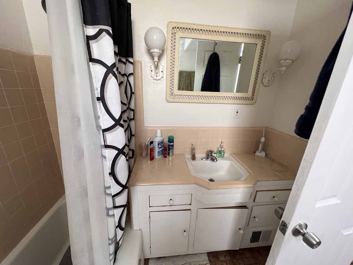 An old, outdated bathroom in need of a renovation.