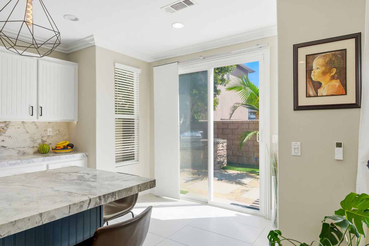Nook off the kitchen with a lot of light coming through the sliding glass door.