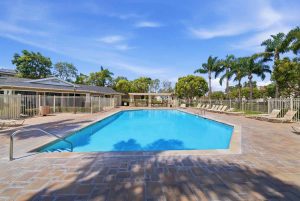Community pool with lounge chairs.