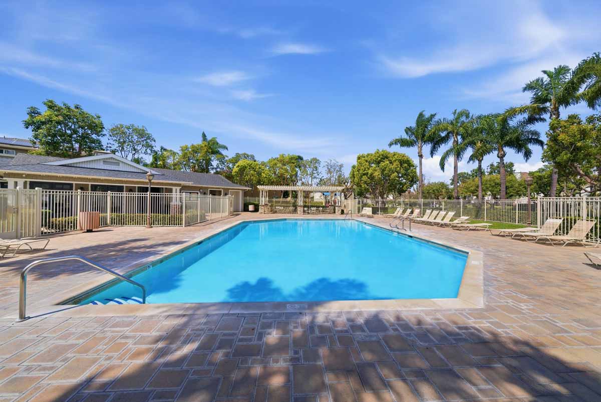 Community pool with lounge chairs.
