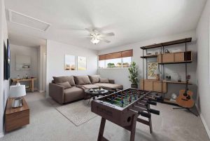 Virtually staged loft with a couch, table, shelves and window.