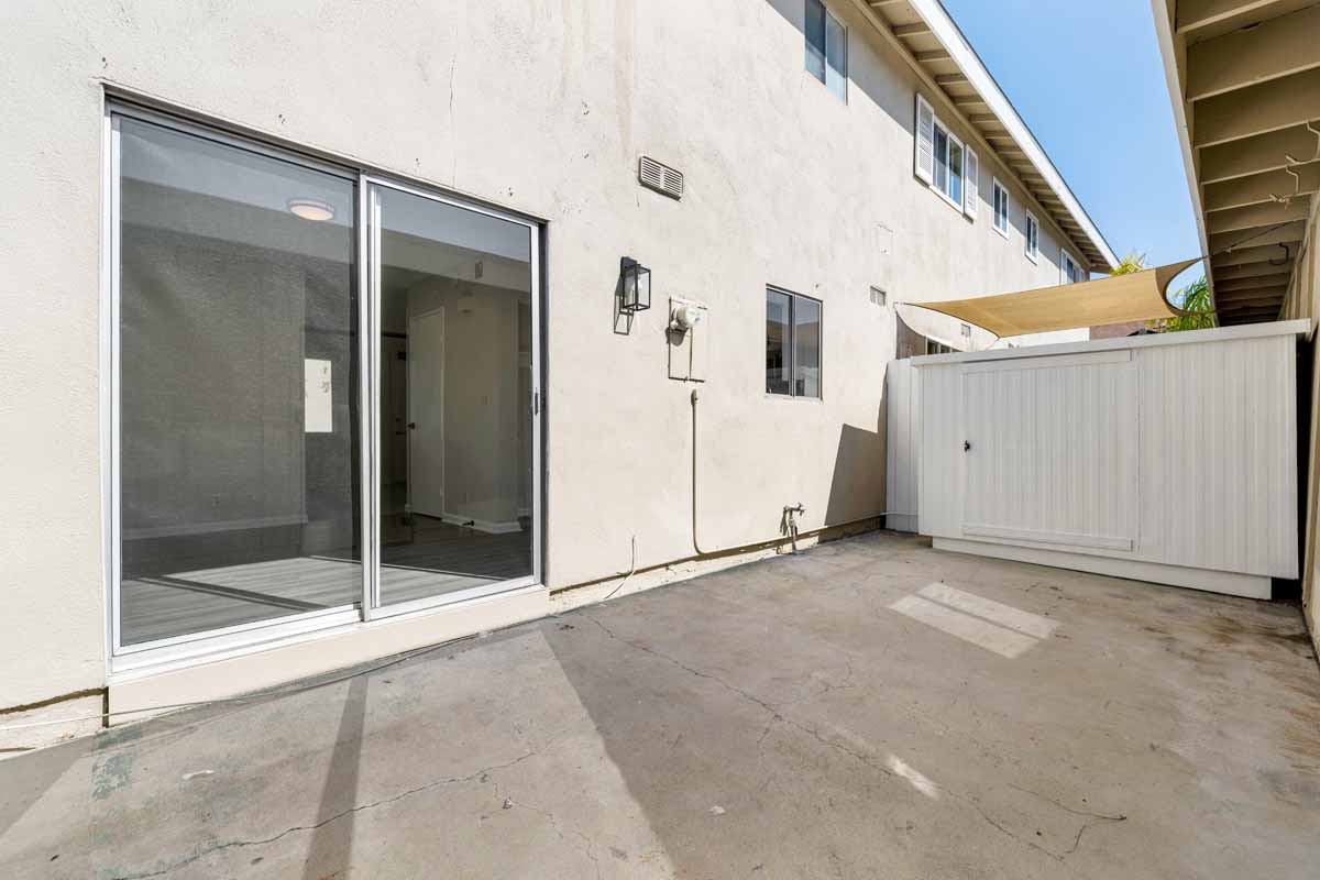 Refinished patio with fresh paint on the stucco walls.