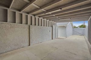 A large covered carport or rv storage space with access to the backyard.