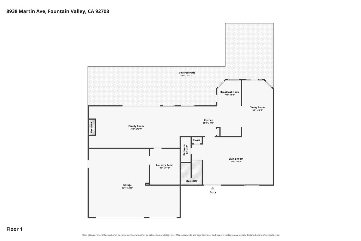 Lower level of floor plan showing garage, kitchen, bathroom, family room, dining room, living room, and laundry room.