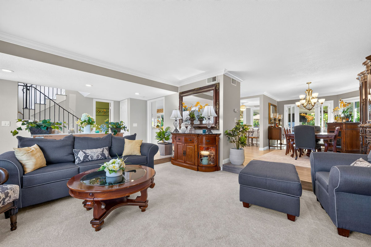 Furnished living room near entry to house.