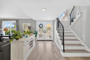 Entry way inside 8938 Martin Avenue, Fountain Valley showing double doors, a staircase and canned lights.