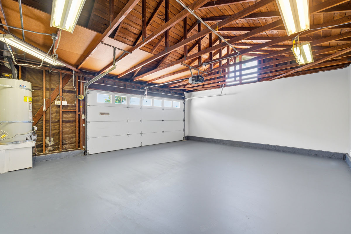 Updated garage with fresh paint, epoxy floors and bright lights.