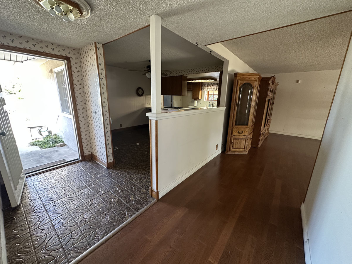 Dark, outdated entryway into home.