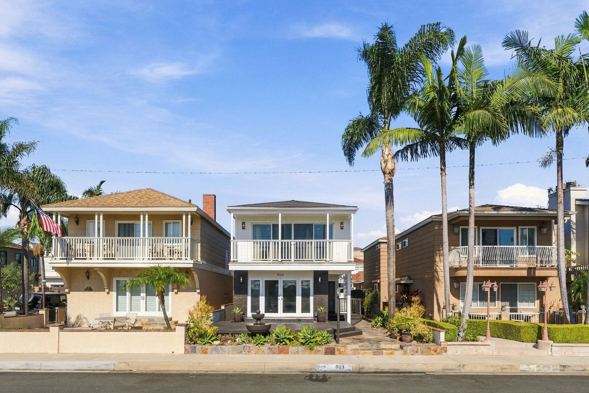 View of the front of 803 Frankfort Avenue, Huntington Beach showing two levels with the second level balcony.