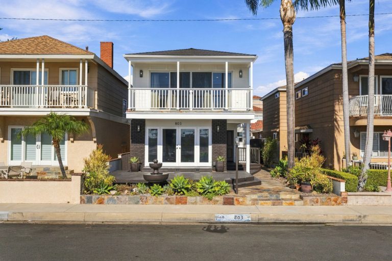 View of the front of 803 Frankfort Avenue, Huntington Beach showing two levels with the second level balcony.