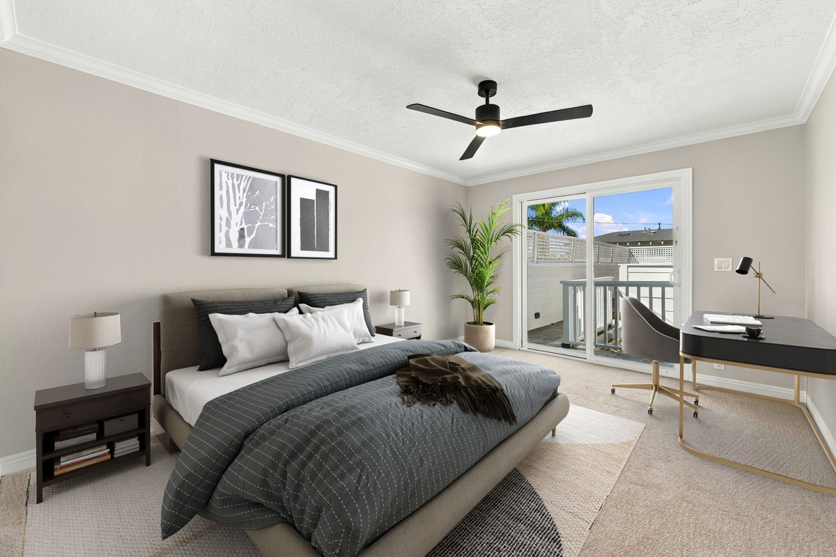 Digitally staged bedroom with bed, ceiling fan, and sliding glass door leading out to balcony.